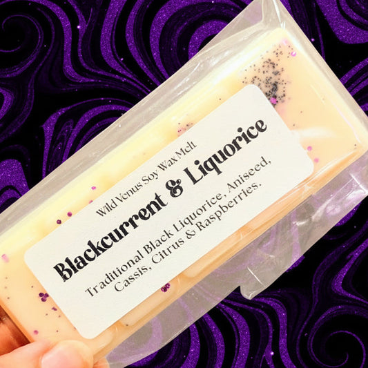Blackcurrant and liquor wax melt against a swirly purple and black background.
