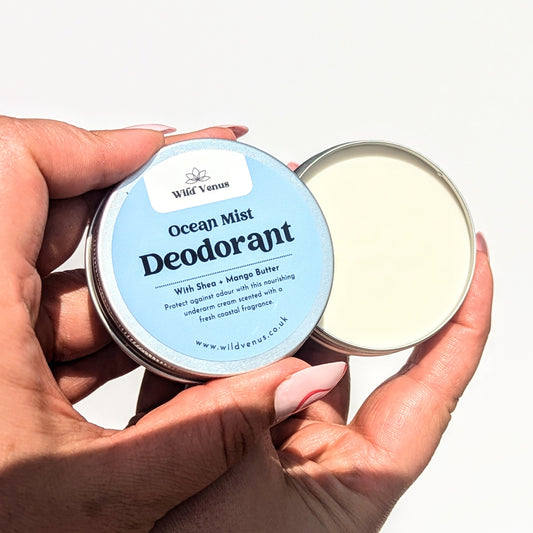 Opening a pot of the Ocean Mist deodorant against a white background. There is a shadown being cast on the lower part of the hands.