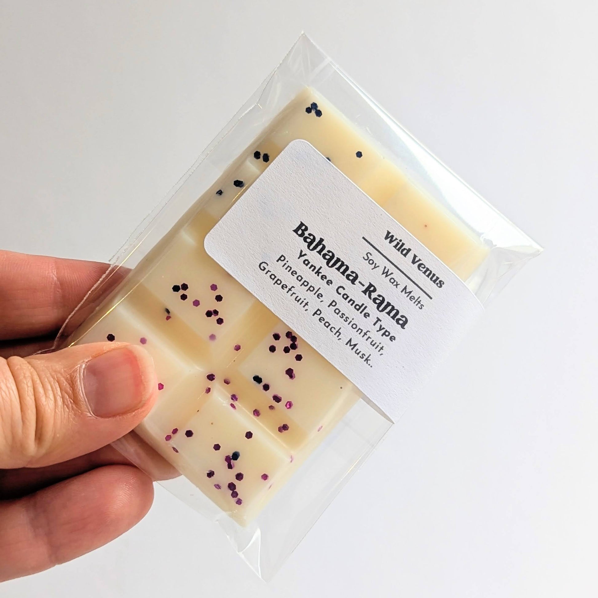 Holding the Bahama-Rama soy wax melt which is like a yankee candle scent. 
