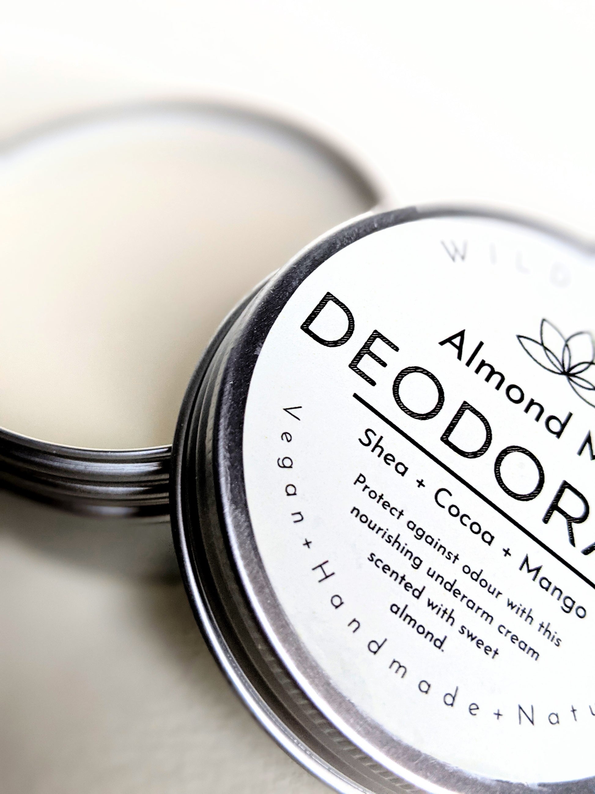 A close up of an open tin of Almond Milk scented Deodorant. 