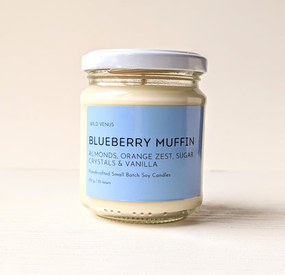 A blueberry muffin scented candle against a white background.
