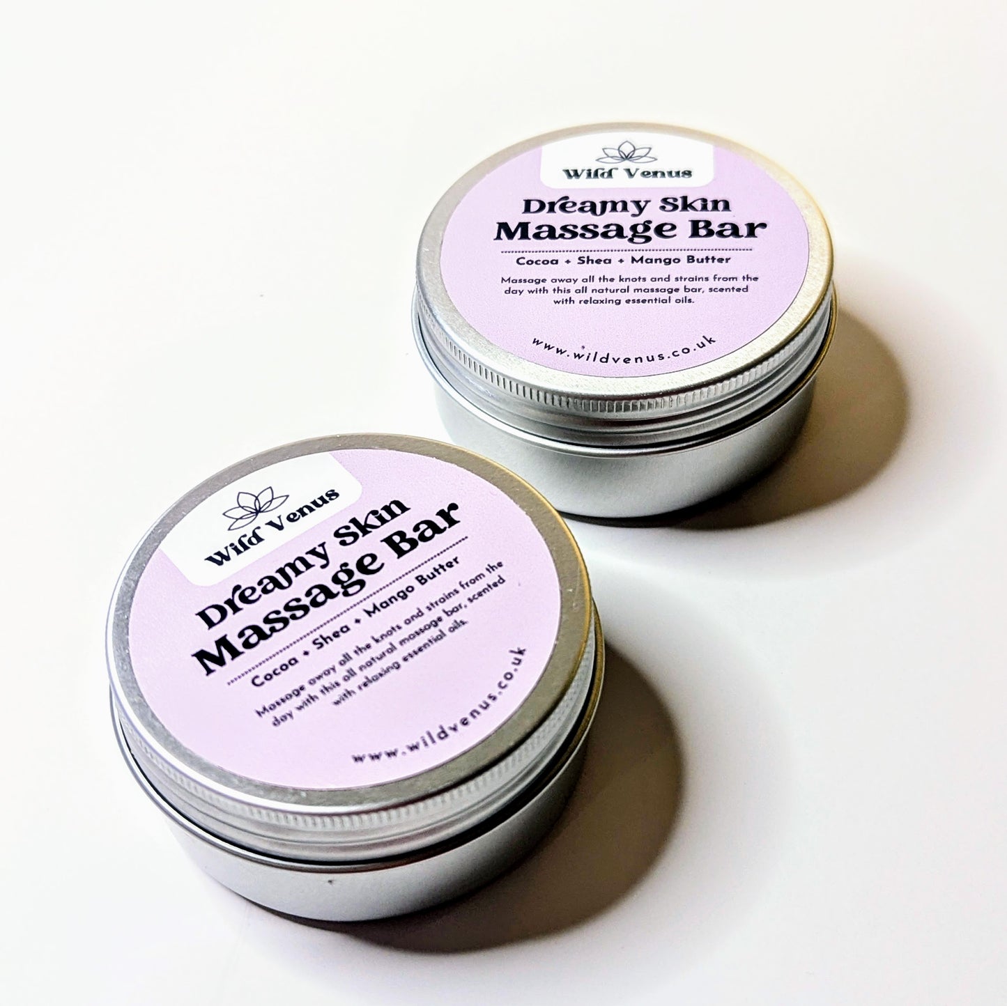 Two tins of the dreamy skin massage bars. 