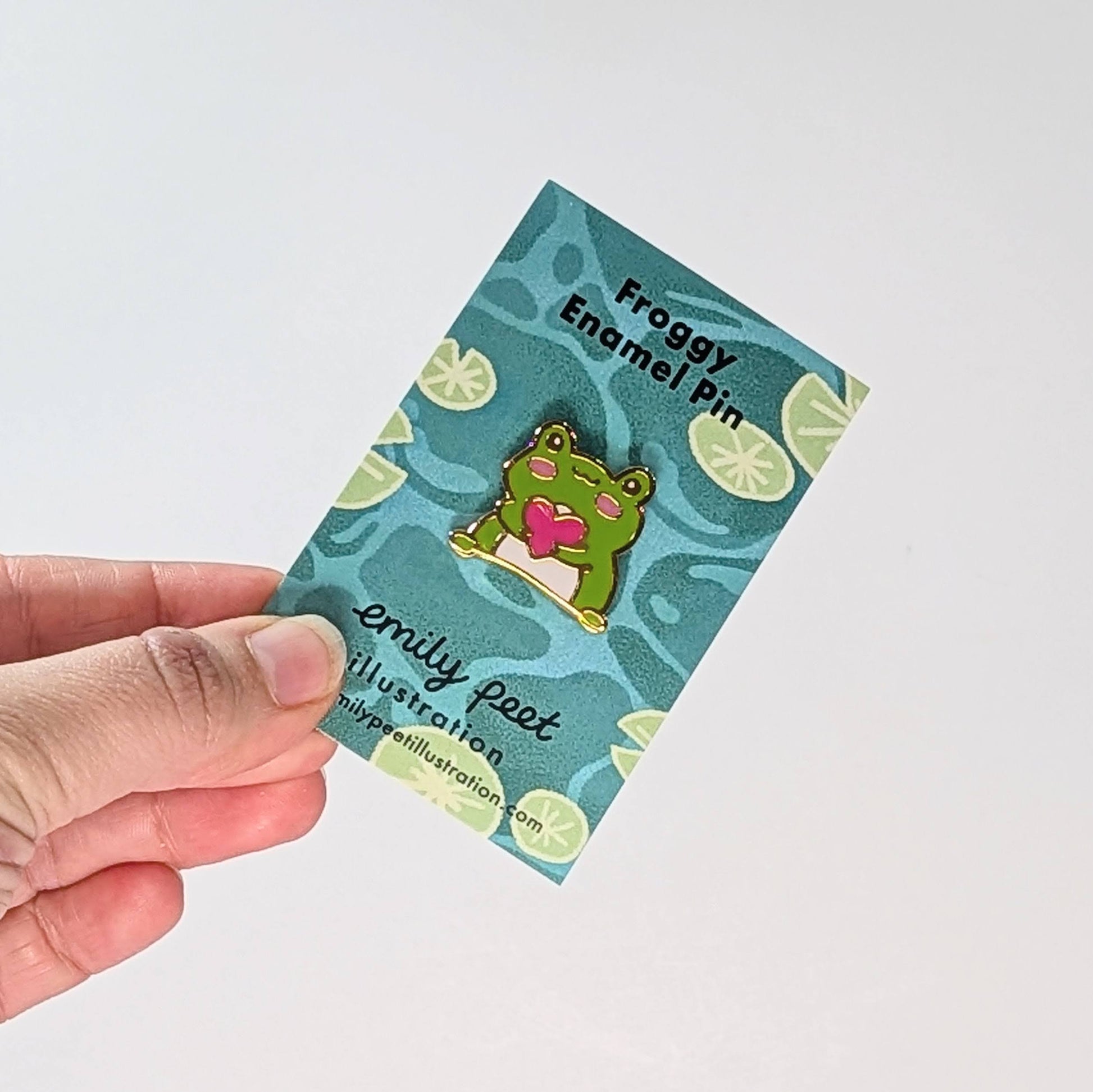 Frog and heart enamel pin by Emily Peet Illustration.
