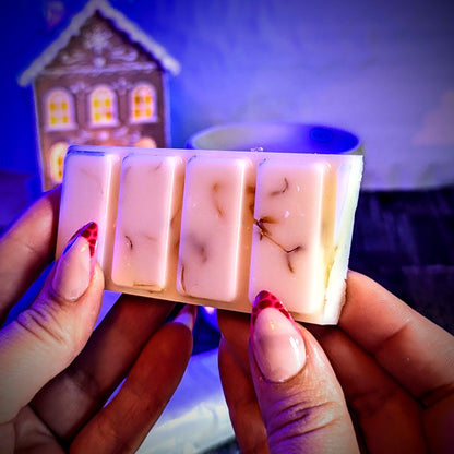 Holding an unwrapped Gingerbread scented soy wax melt. 