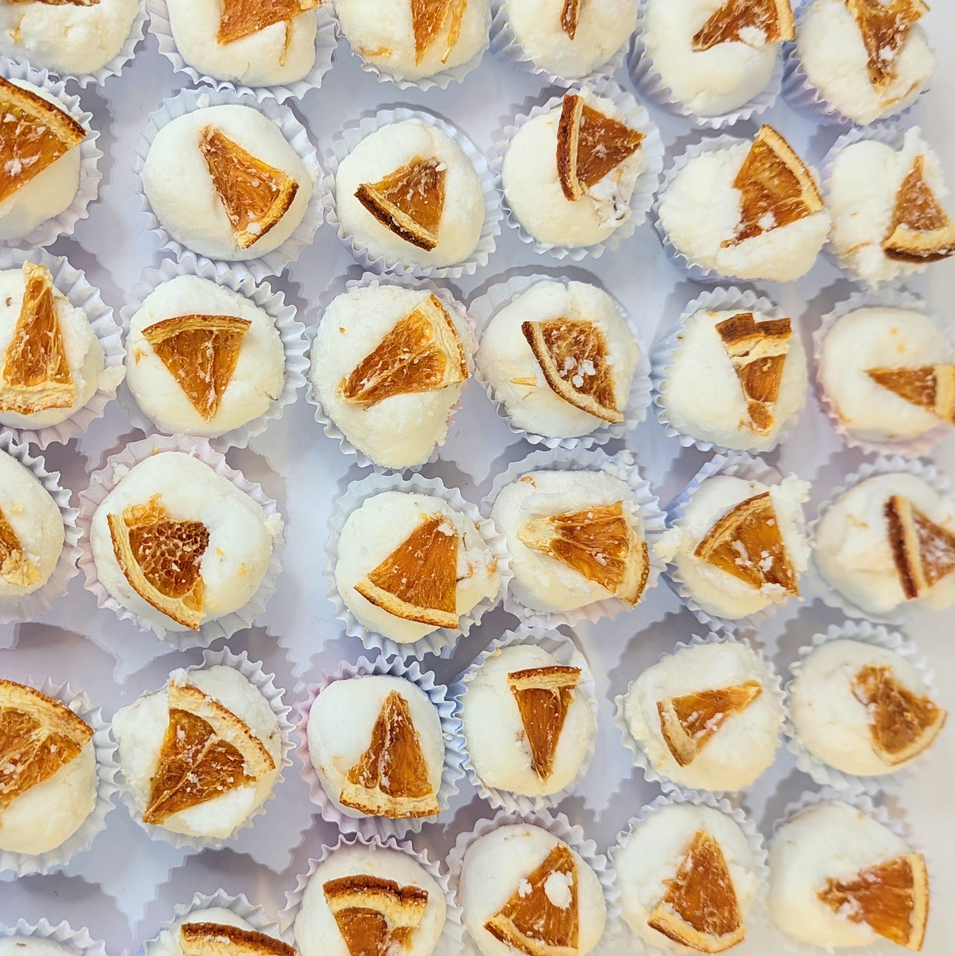 A photo of spiced orange mango butter bath bombs from above.