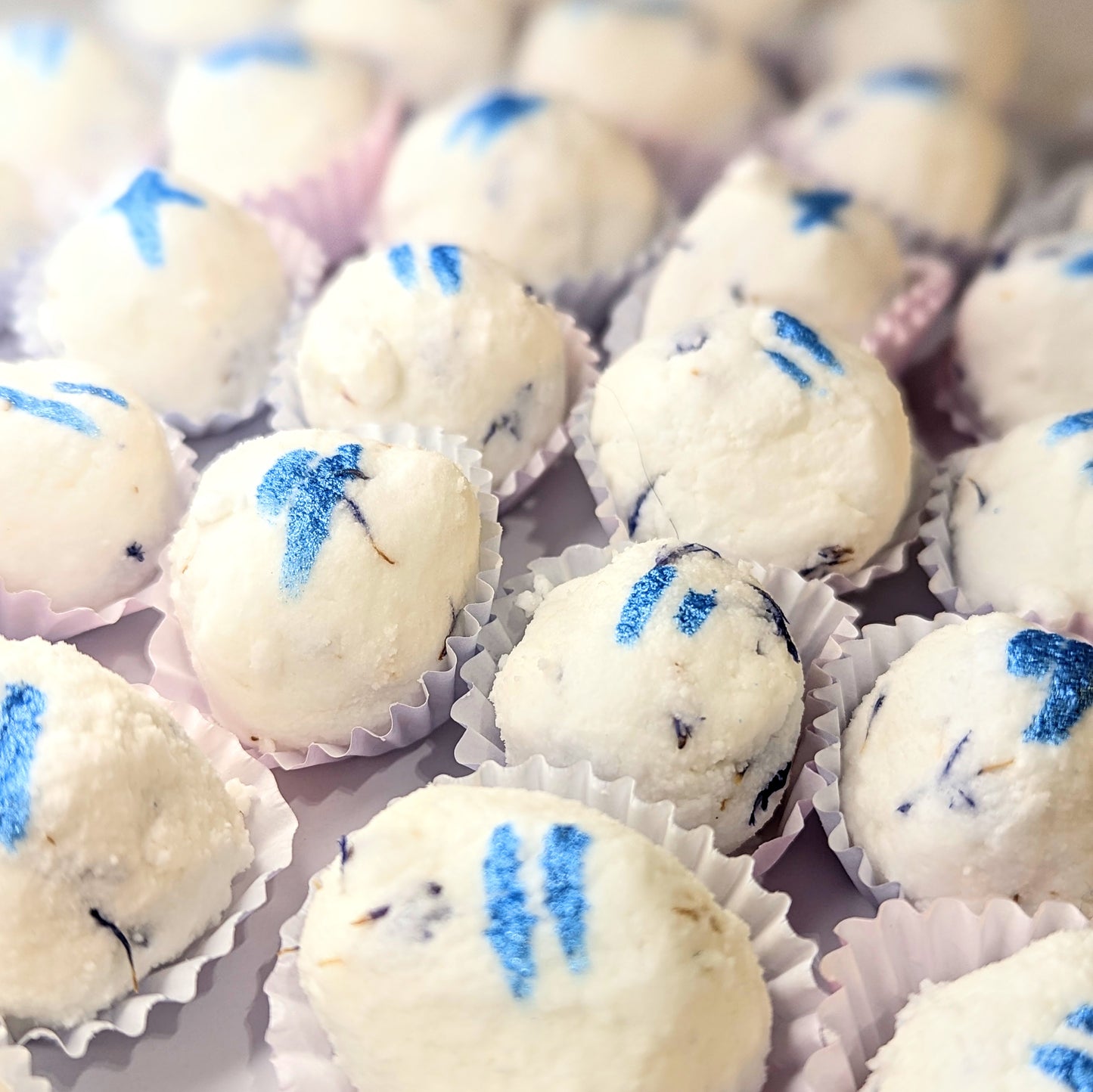 A photo of the starry night mango butter bath bombs.