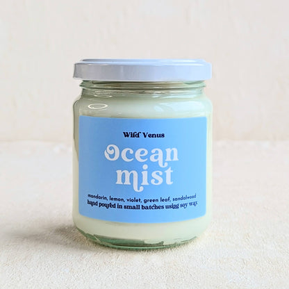 An Ocean Mist scented soy candle is against a plain white background. 
