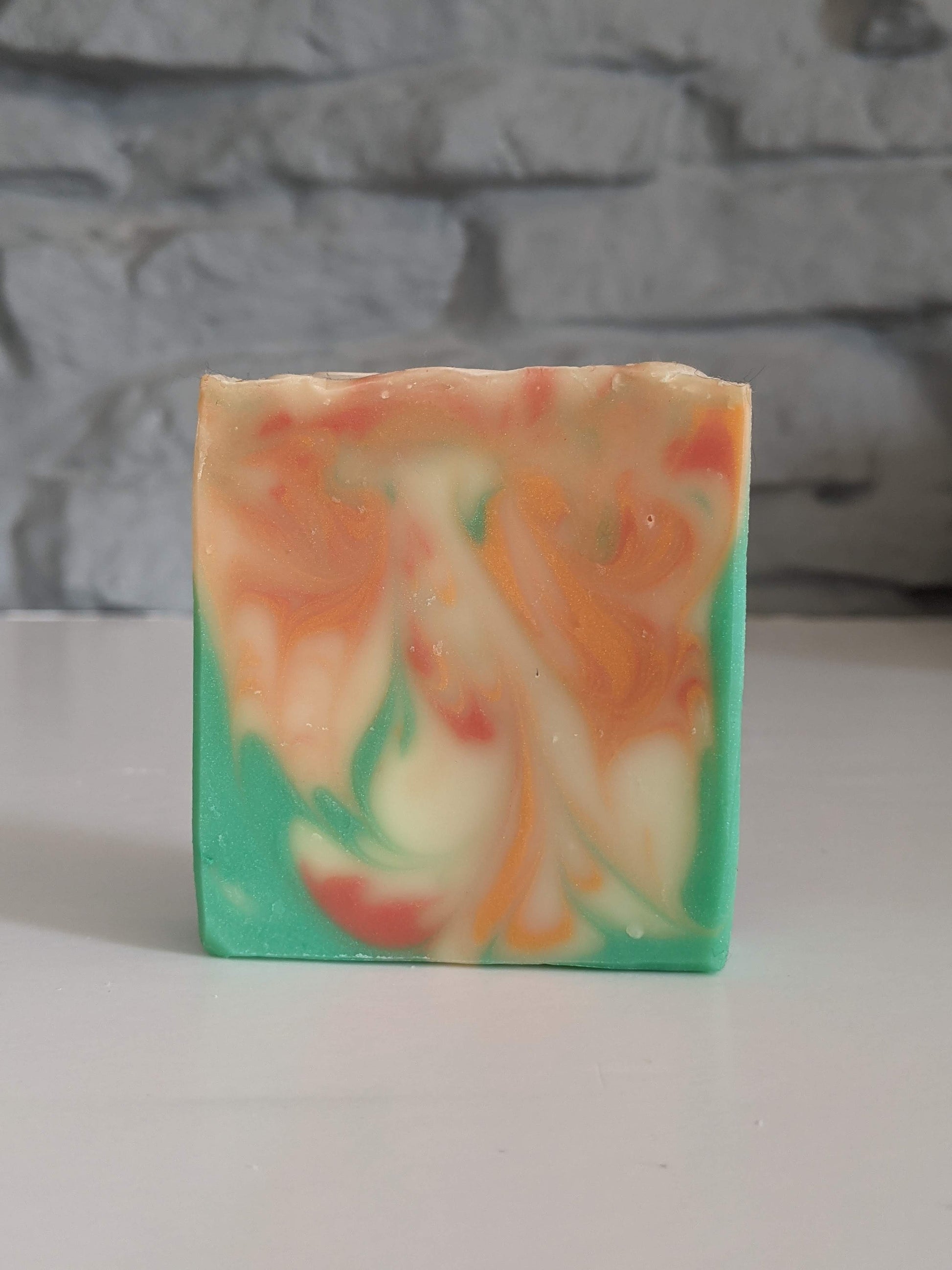 Soul Sister is a bright and swirly soap with greens, orange and red.