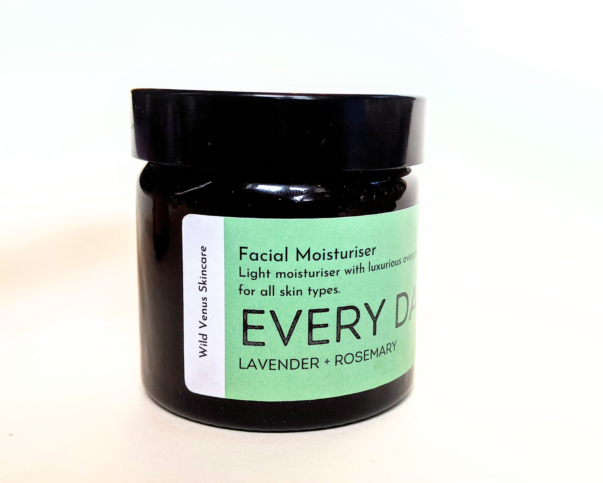 A closed jar of the EVERY DAY facial moisturiser, shown from a side angle. 