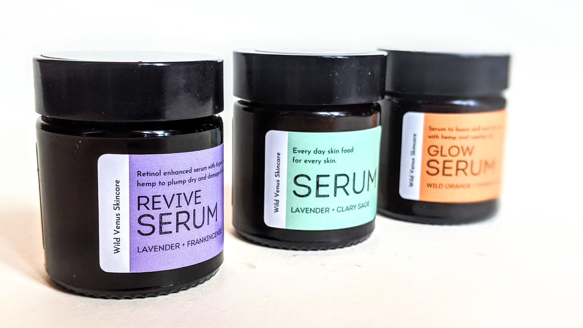 Three jars of serum in a row, including the Revive, Every Day and Glow variations. 