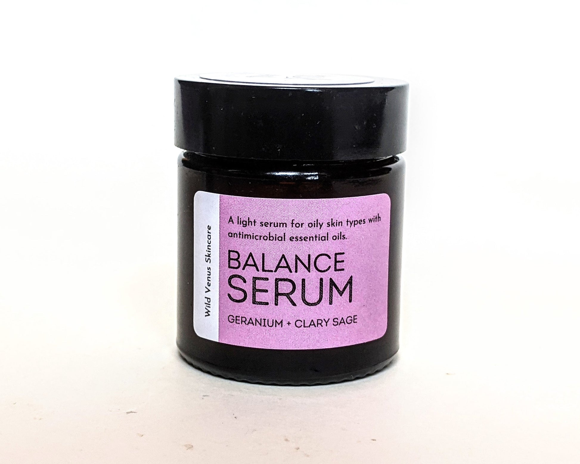 A closed jar of BALANCE serum. 