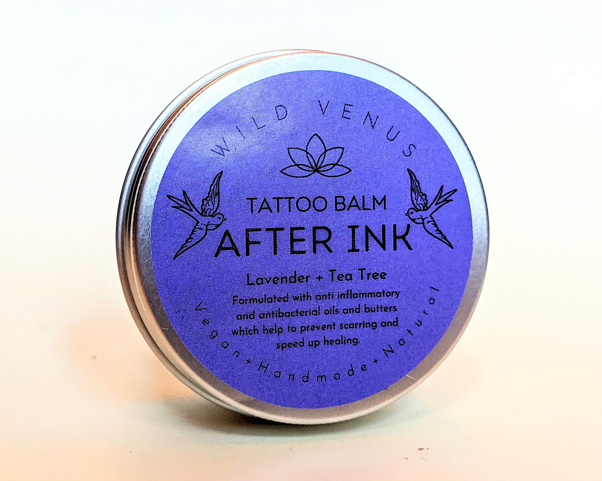 A tin of After Ink tattoo balm. 