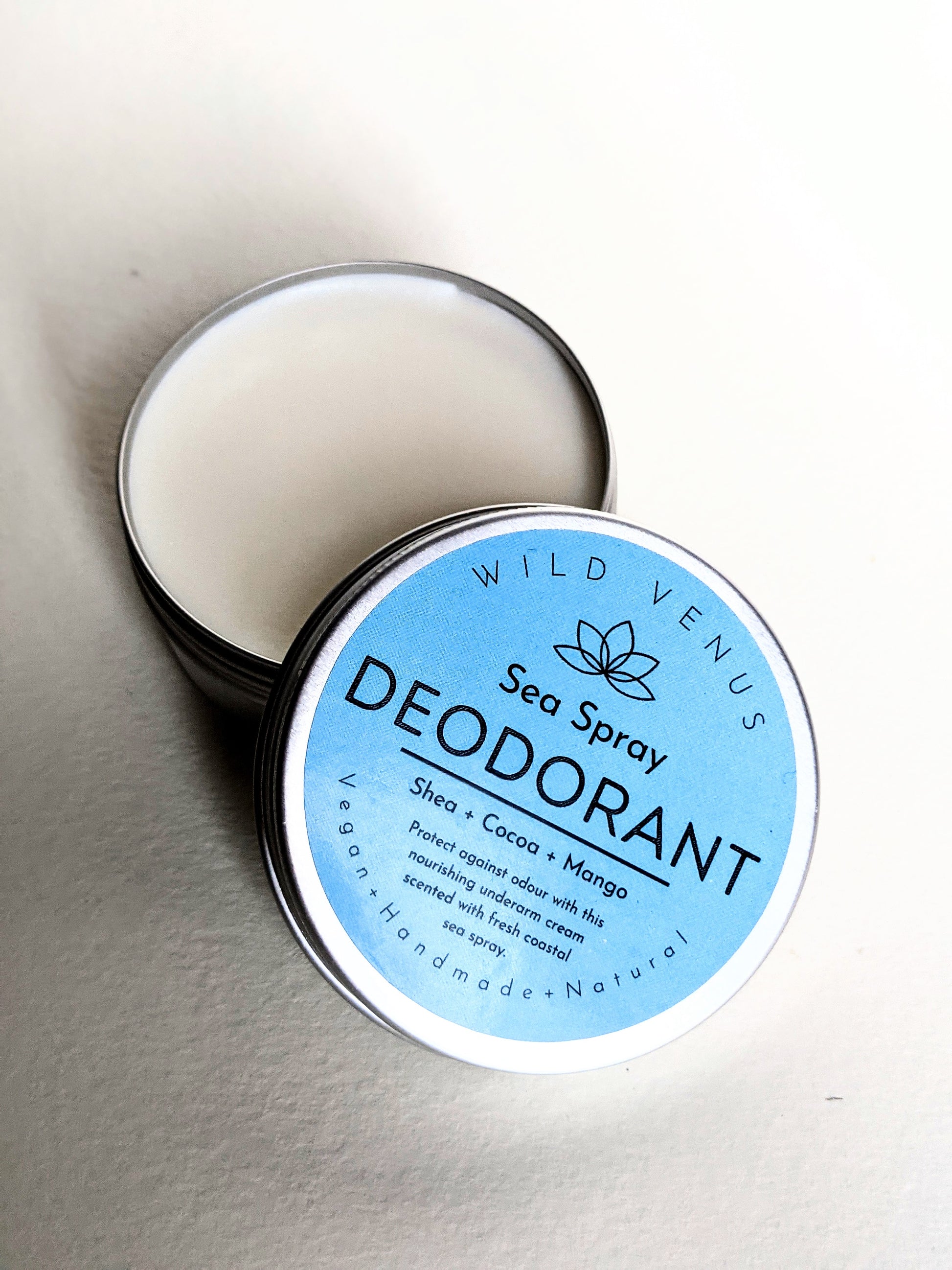 An open tin of Sea Spray Deodorant.