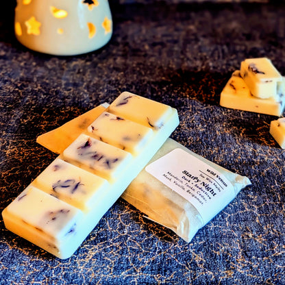 An unwrapped large bar of the starry night soy wax melt. 