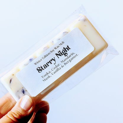 Holding the starry night soy wax melt against a white background.