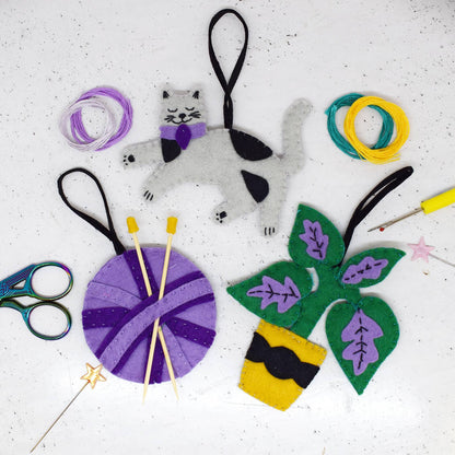 The crafty cat set creates a cat, ball of yarn and a plant.