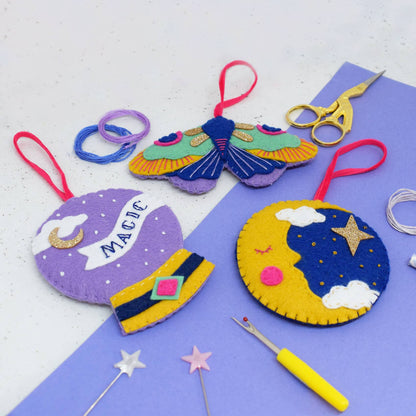 The magical felt stitching kit contains a moon, a moth and a crystal ball. 