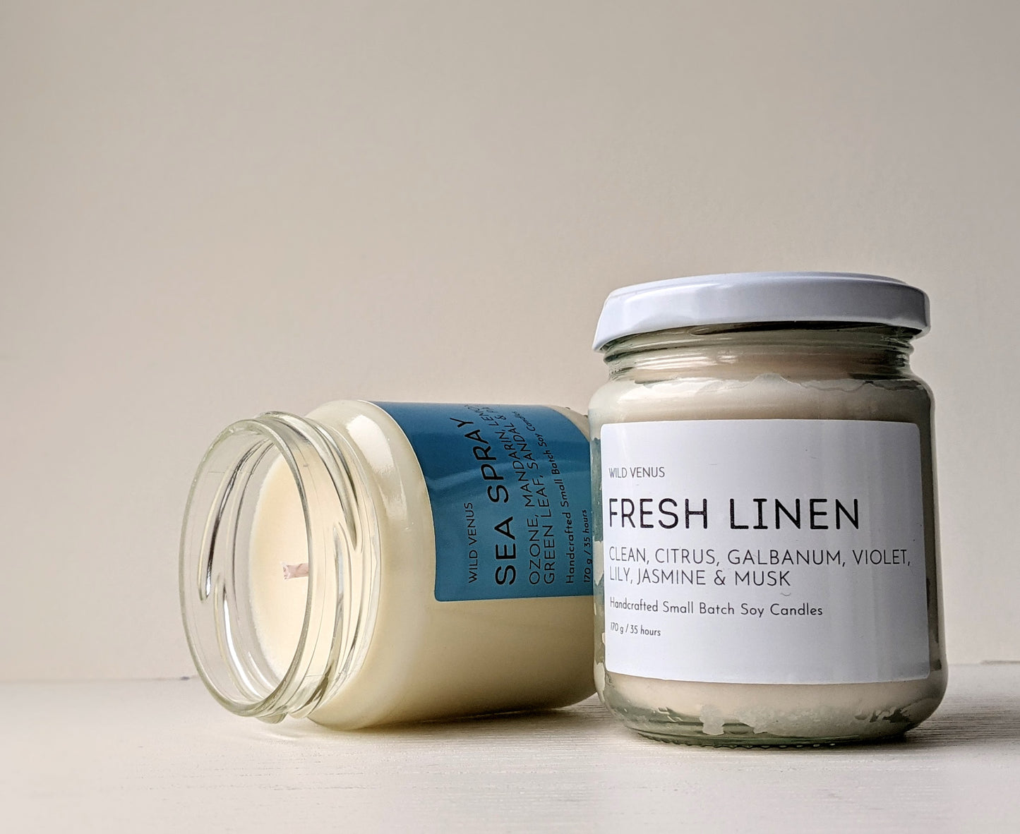 A Fresh Linen soy candle and a sea spray soy candle. 