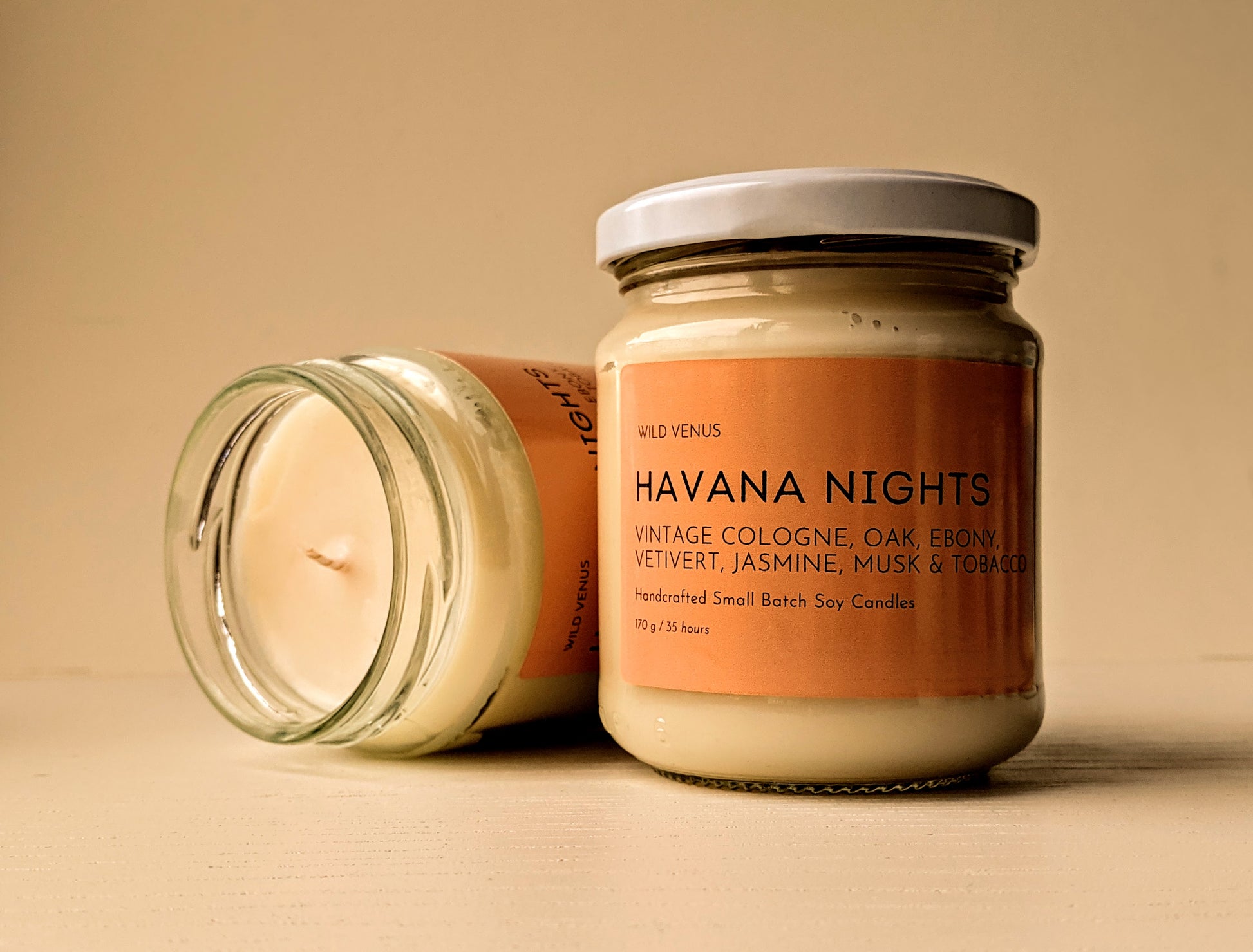 Two Havana Nights candles with an orange hue. 
