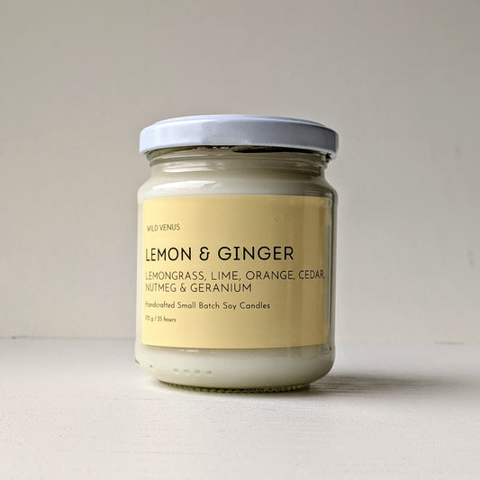 A Lemon and Ginger scented hand poured soy candle against a white background. 