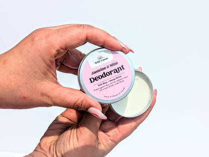 Holding an open Jasmine and Mint Deodorant