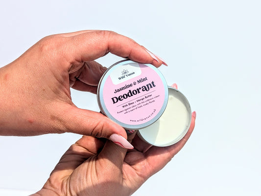 Holding an open Jasmine and Mint Deodorant