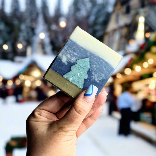 Holding a christmas tree soap.