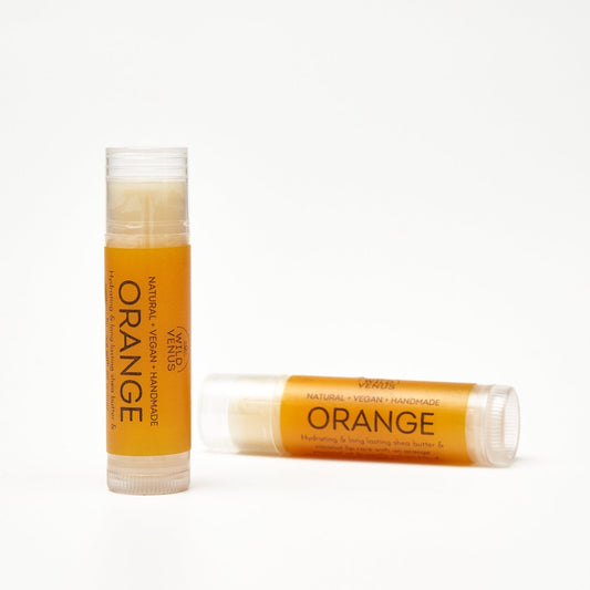 Orange lip balms made with essential oils. 